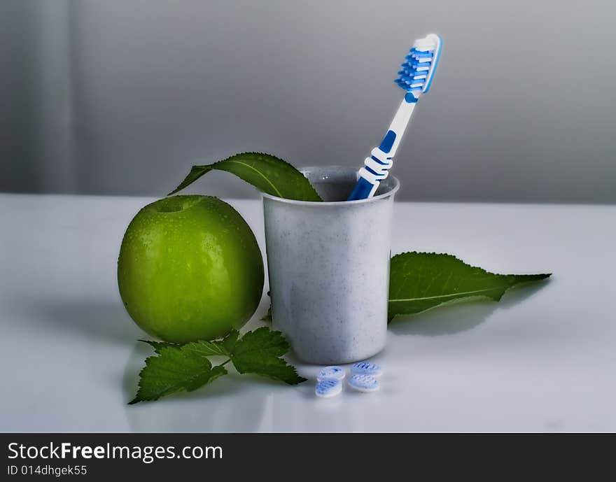 Toothbrush and apple, close up shot. Toothbrush and apple, close up shot