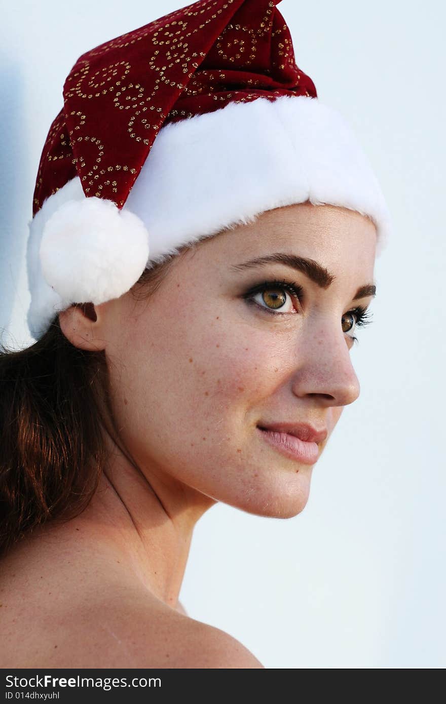 Isolated Christmas portrait of a happy woman with a gift.