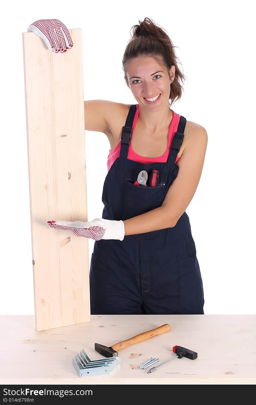 Woman carpenter holding wooden plank on white background