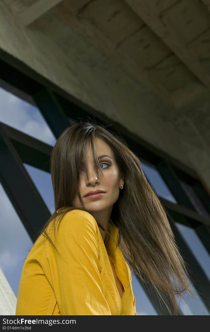 Beautiful young woman waving hair