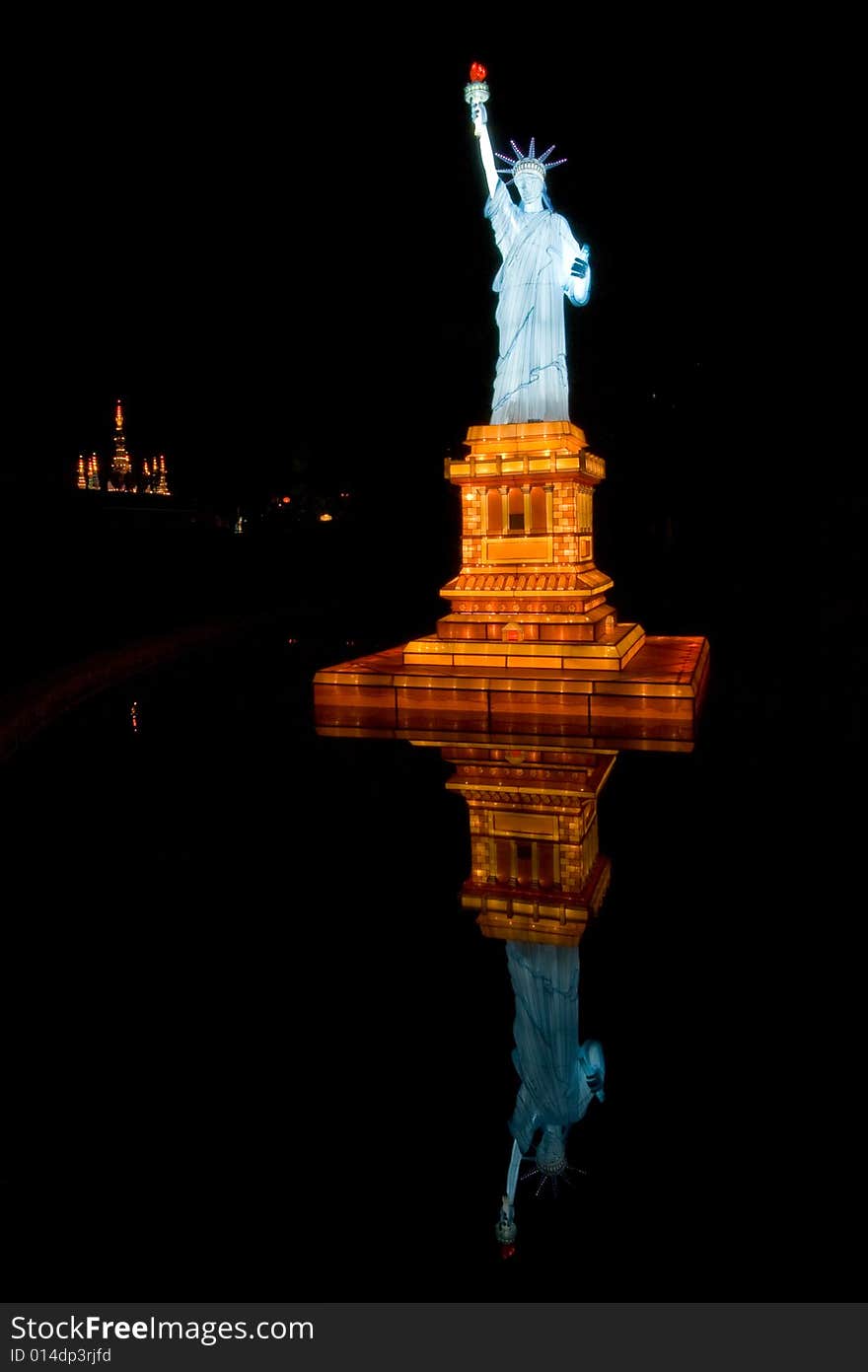 Statue of Liberty in night waters