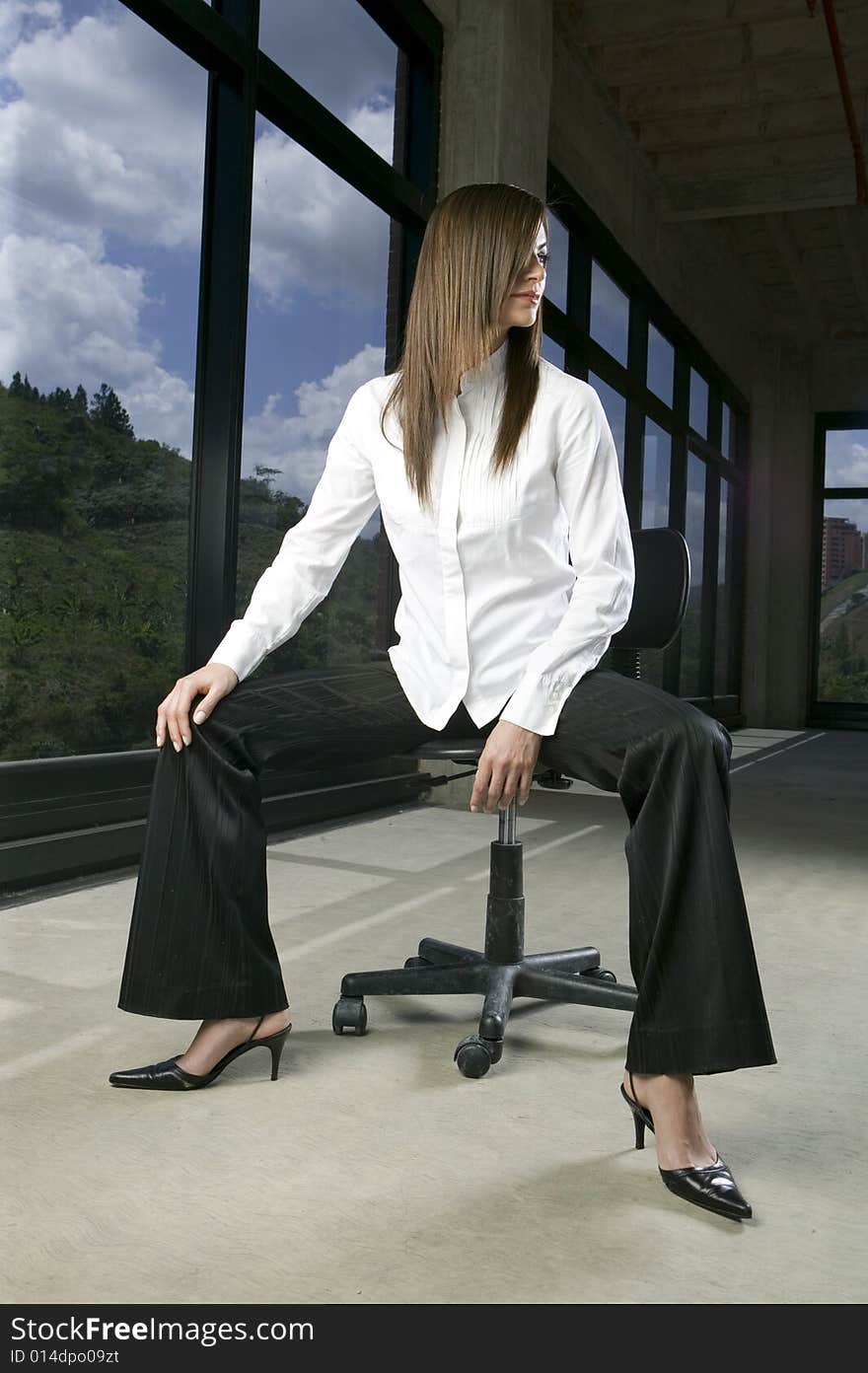 Seated Young Woman With Hair Over Face