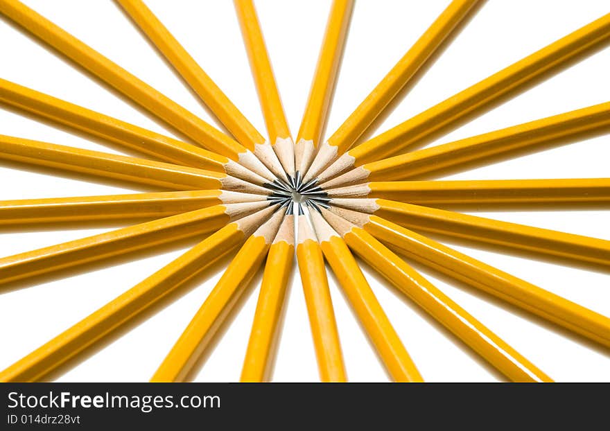 Vibrant Ring of Yellow Pencils arranged in a circle pattern like the spokes of a tire