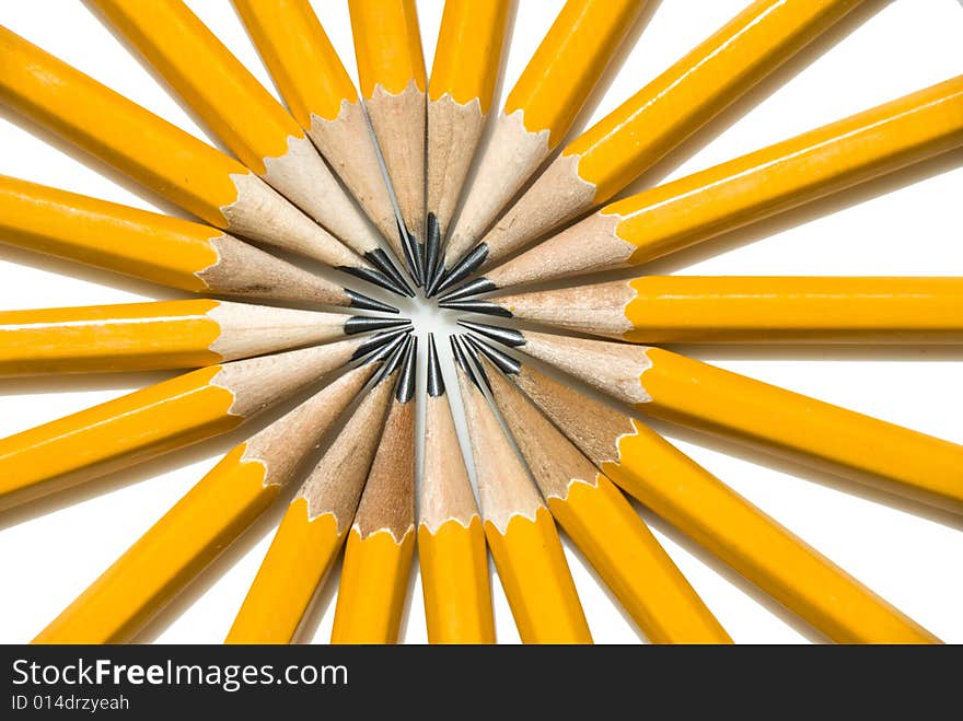 Vibrant Ring of Yellow Pencils arranged in a circle pattern like the spokes of a tire. Vibrant Ring of Yellow Pencils arranged in a circle pattern like the spokes of a tire