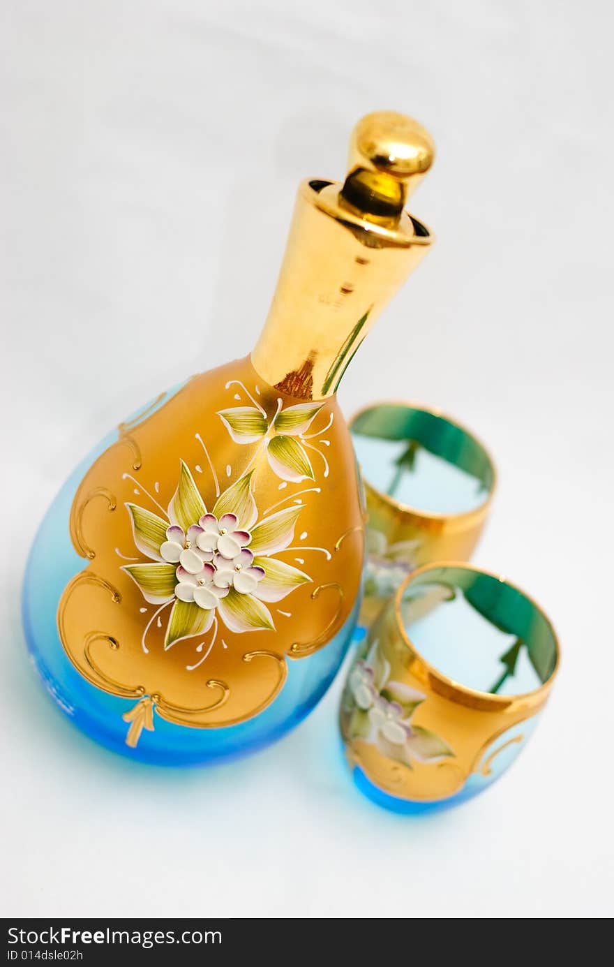 Glass jug and goblets handmade in Venice. Light blue tints with floral and gold leaf adornments. Glass jug and goblets handmade in Venice. Light blue tints with floral and gold leaf adornments.