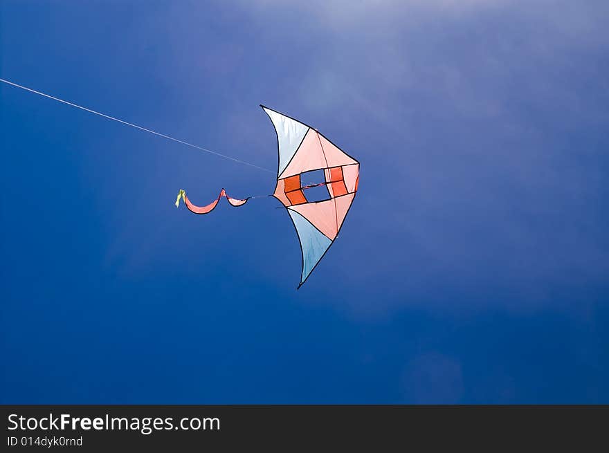 Kite in the blue sky (summer background)