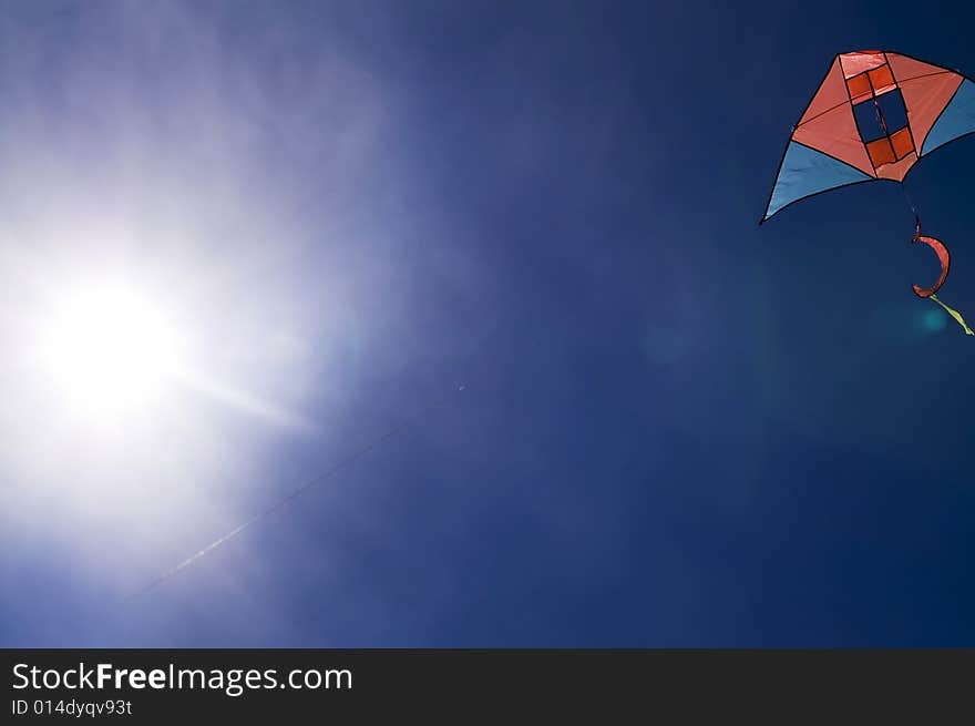 Kite in the blue sky (summer background)