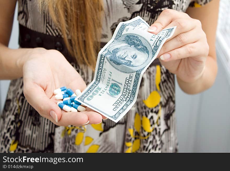 Medicine  capsules and money