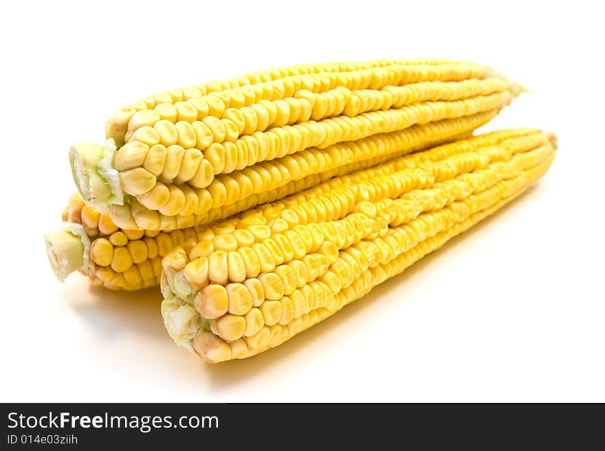 Three yellow corns