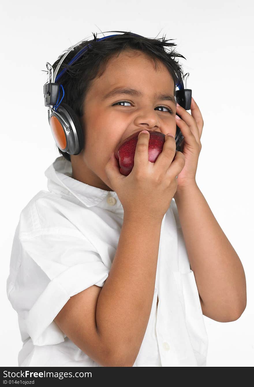 Asian boy biting a red apple. Asian boy biting a red apple