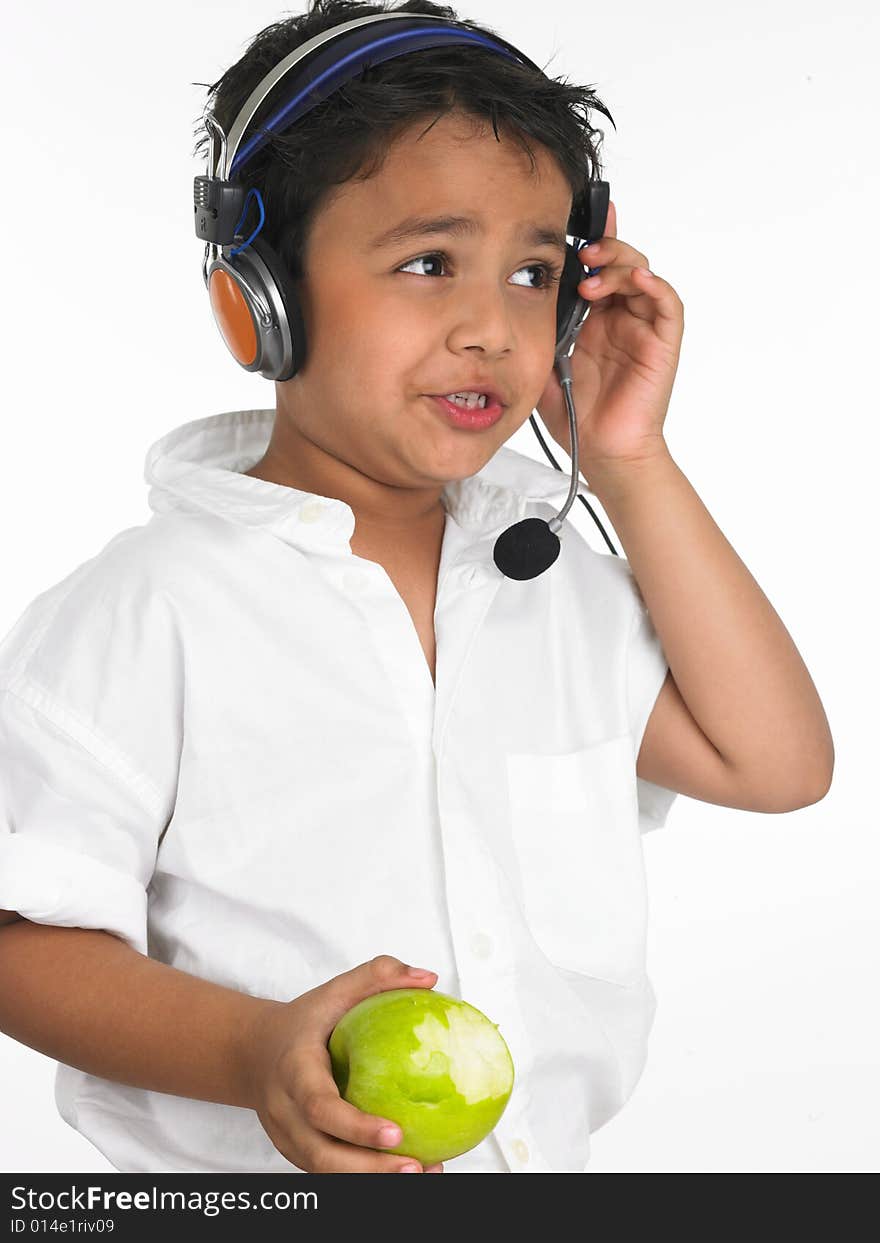 Boy biting into a green apple