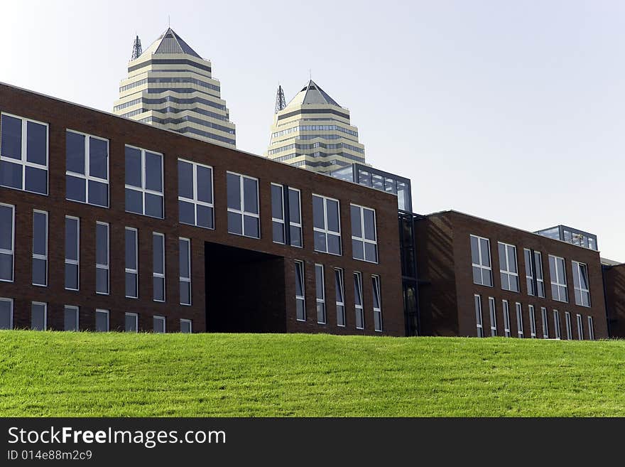 Modern buildings on a green grass