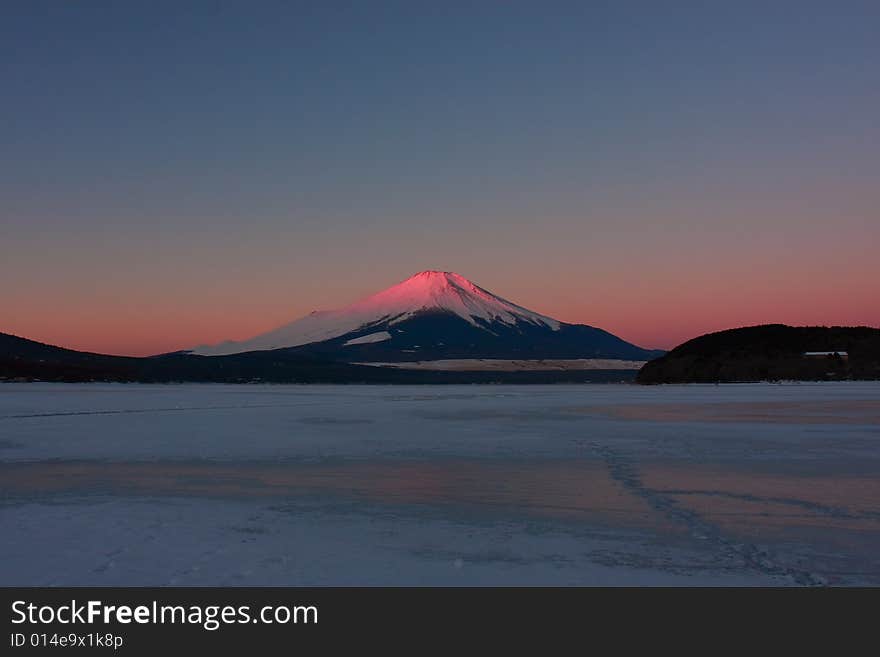 Fuji turning red in early winter morning, called red-Fuji. it isn't something we see every day. outside temp is -20　degrees at this time.　Lake Yamanaka is freeze-up. Fuji turning red in early winter morning, called red-Fuji. it isn't something we see every day. outside temp is -20　degrees at this time.　Lake Yamanaka is freeze-up.