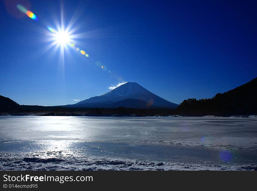 Mt. Fuji with the Sun. This photo is taken in the winter morning. Mt. Fuji with the Sun. This photo is taken in the winter morning.