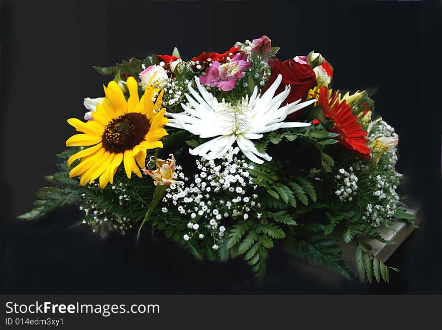 Vase with summer fresh flowers on the black background. Vase with summer fresh flowers on the black background