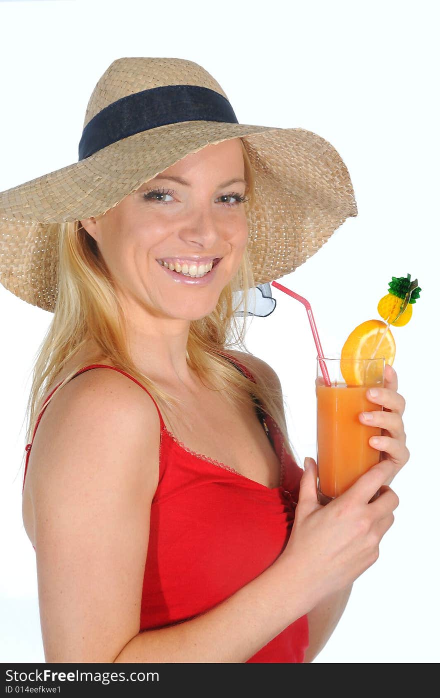 Young woman enjoying a long drink with straw.Wearing a straw hat. Young woman enjoying a long drink with straw.Wearing a straw hat.