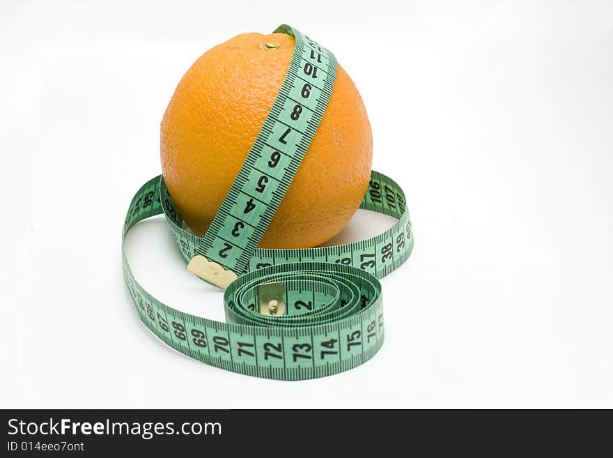 Orange with tape measure on white background