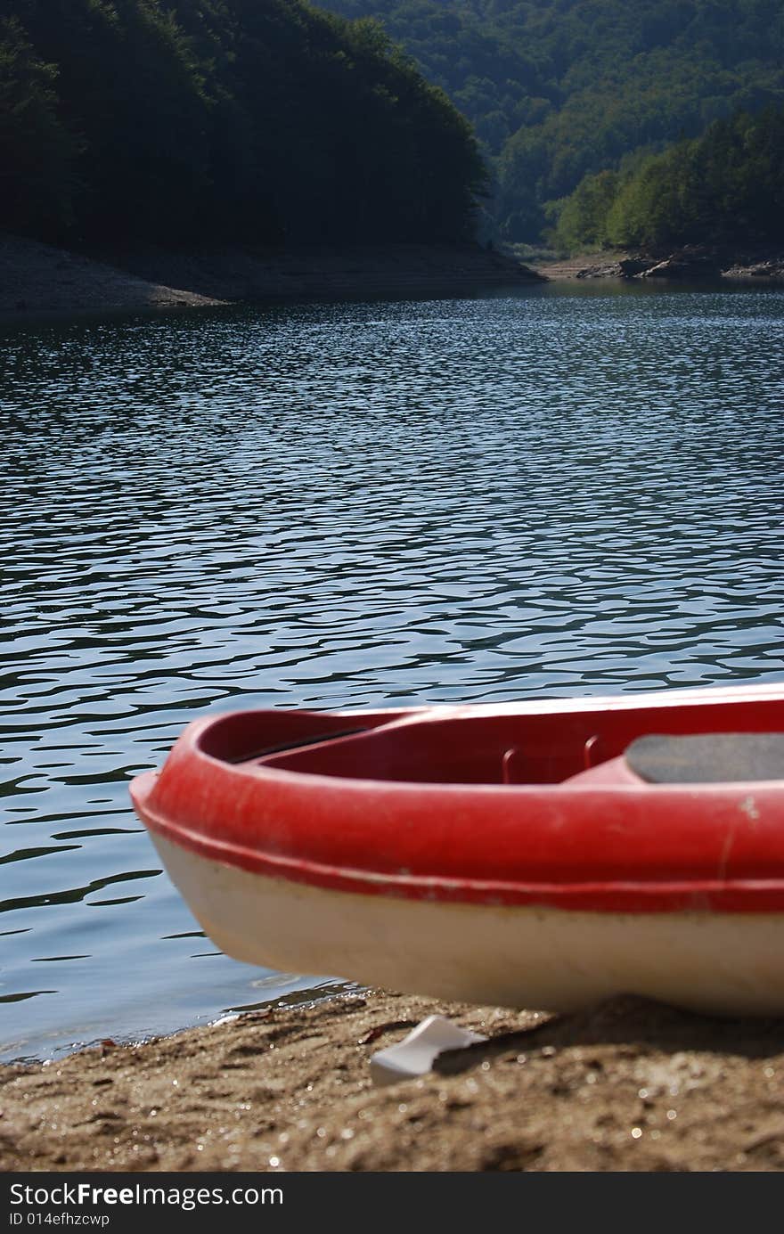 Red boat resting on the beach. Red boat resting on the beach