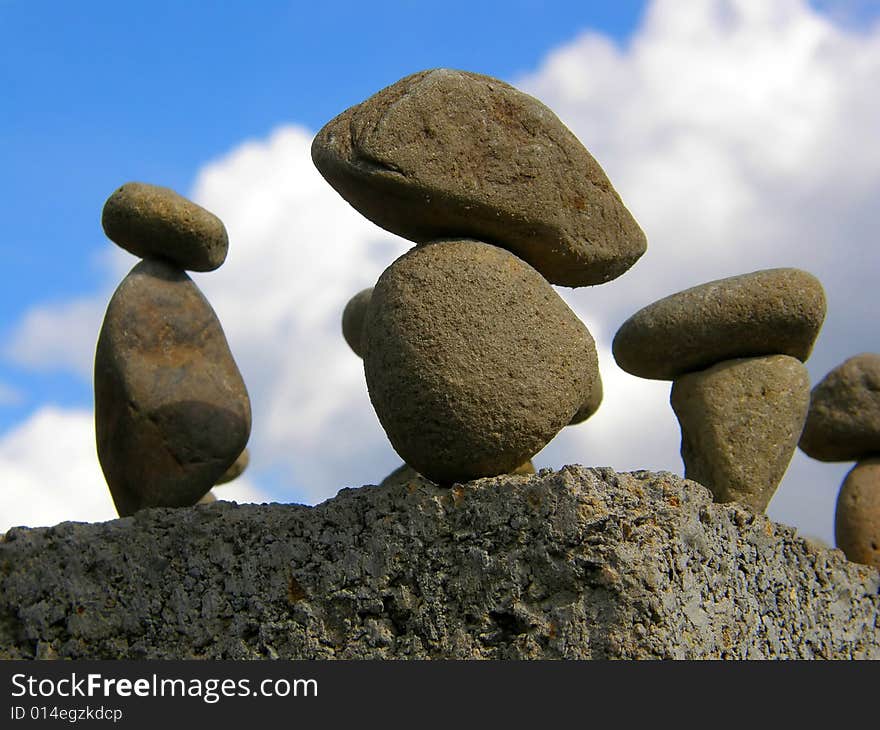 Figure from several stones on a sky background. Figure from several stones on a sky background