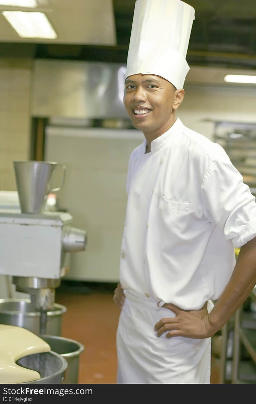 Chef pastry at work smiling