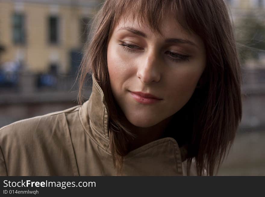 Portrait of young beautiful woman in raincoat. Portrait of young beautiful woman in raincoat