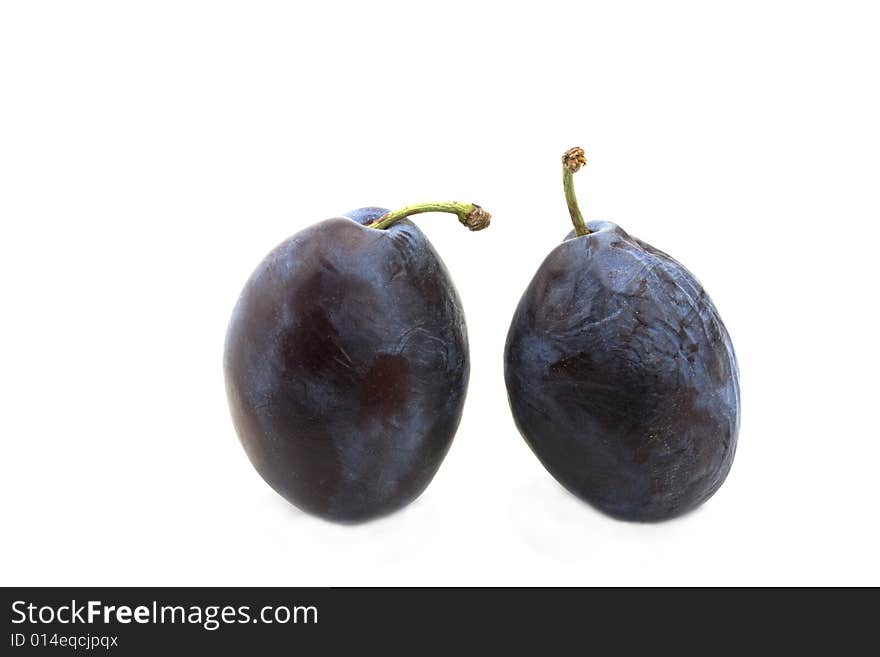 Fresh plums on white background