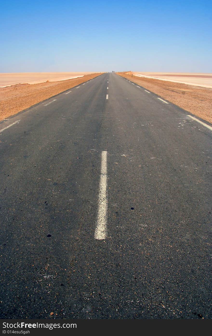 Road near Salt-lake Chott El Jerid in Tunis.