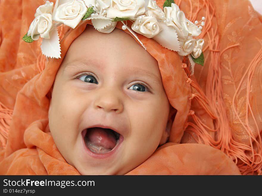 Little Eleonora wrapped in orange shawl. Little Eleonora wrapped in orange shawl