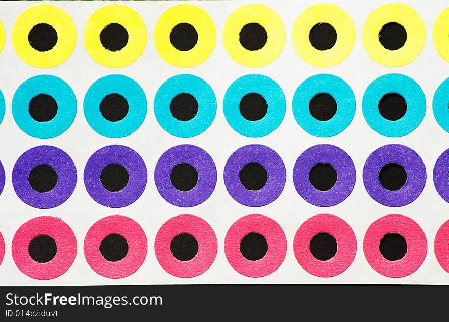 Colored paper hole reinforcements in various colors. Colored paper hole reinforcements in various colors