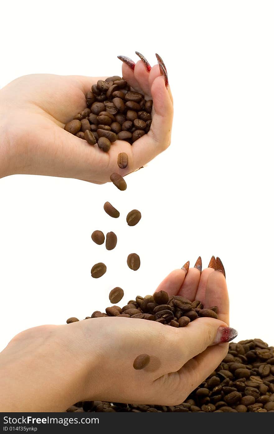 Female hands and coffee beans