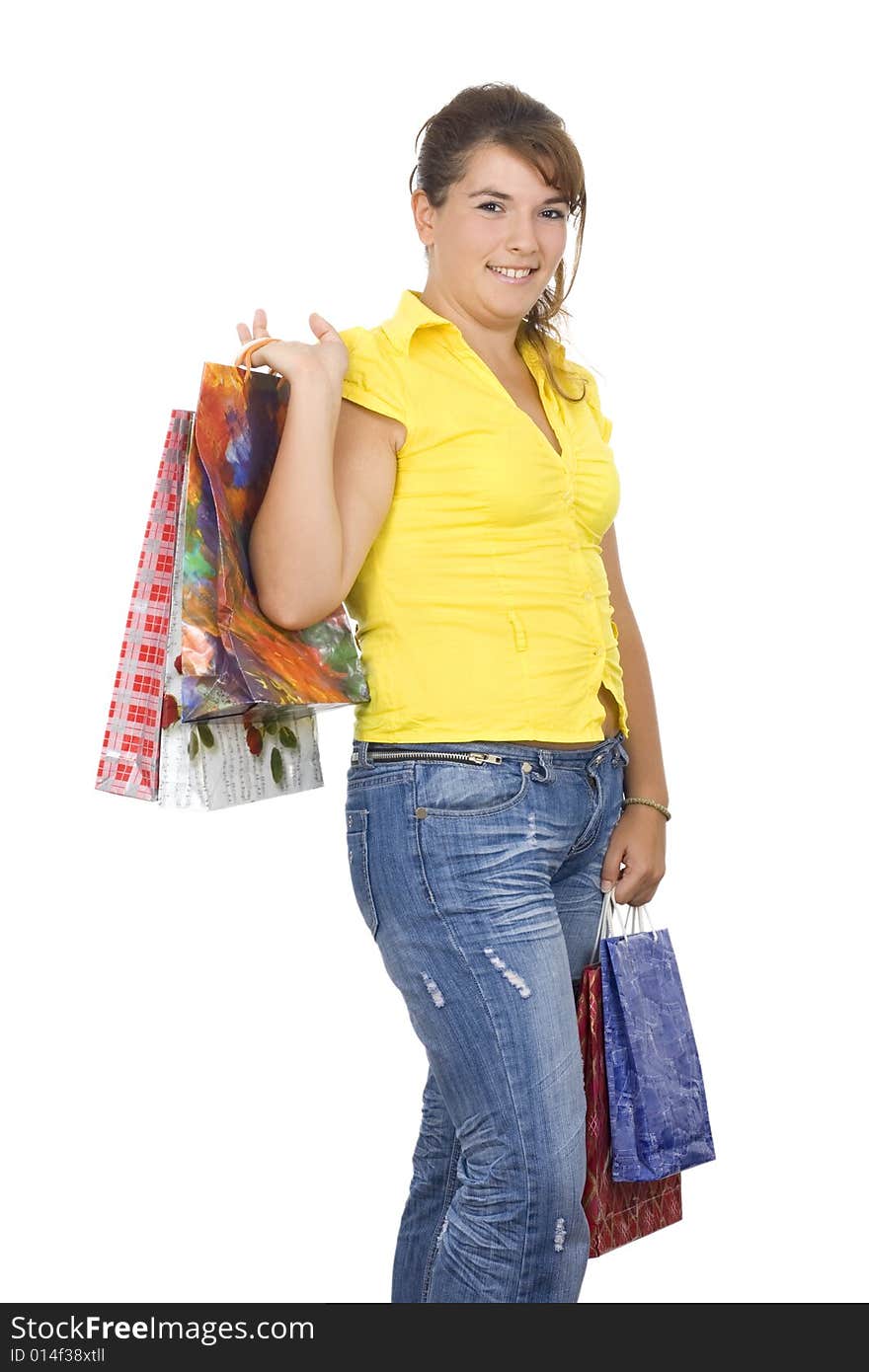 Happy girl holding shopping bags, isolated, on white background