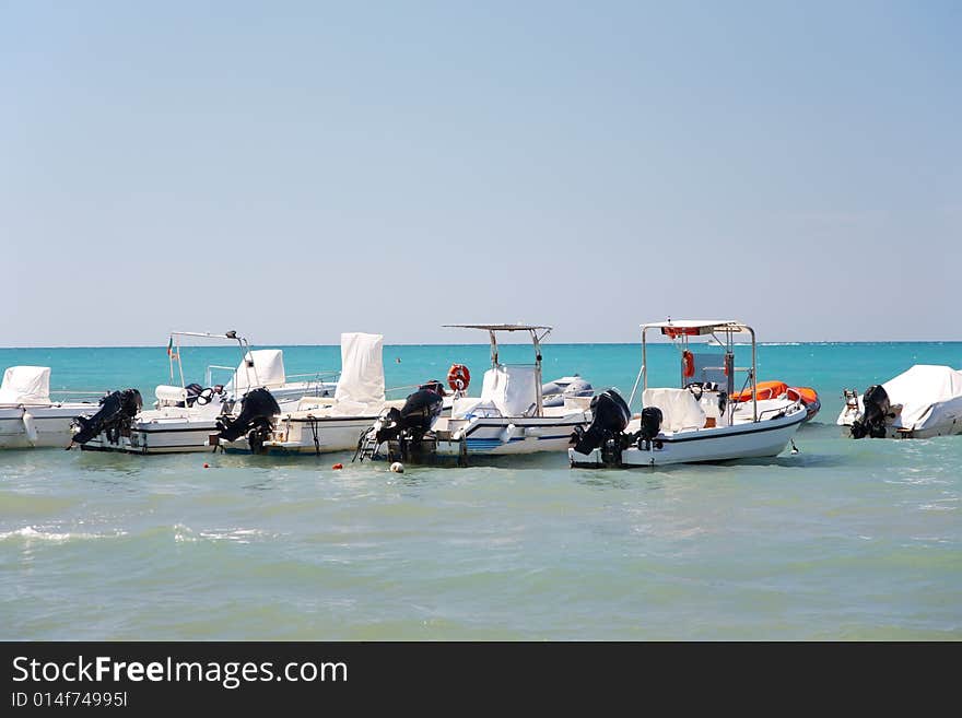 Motorboats anchored in a tropical sea. Horizontal frame. Motorboats anchored in a tropical sea. Horizontal frame.