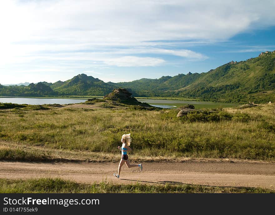 Young girl jogging in the country. Young girl jogging in the country