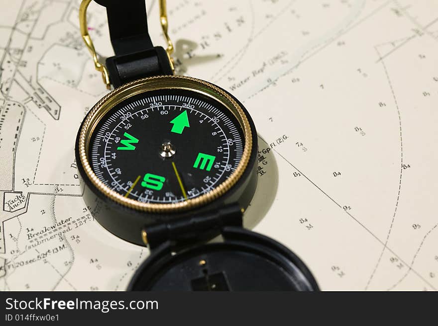 Navigational tools and compass on a nautical navigation map. Navigational tools and compass on a nautical navigation map