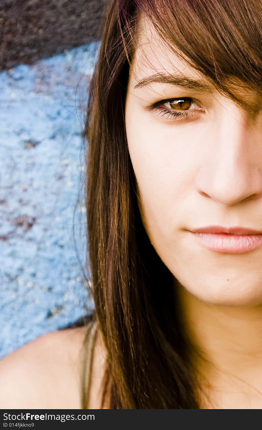 Half full portrait of a young long haired woman.