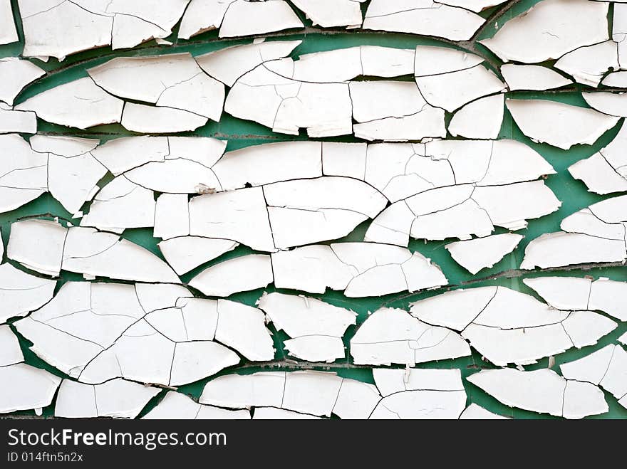 Painted cracked glass with green background