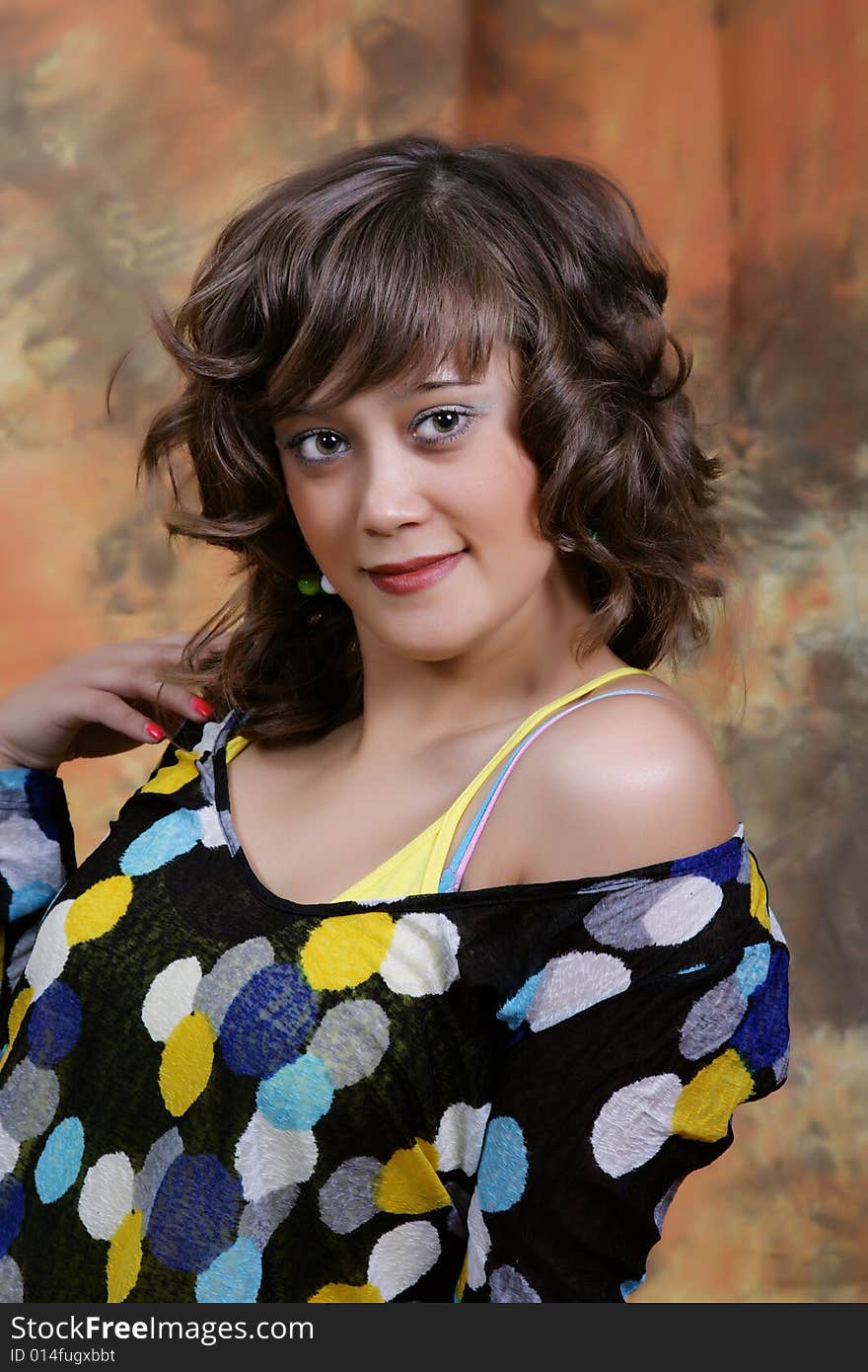 Portrait of the beautiful young woman in studio