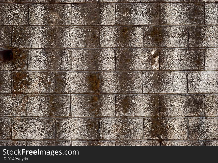 Old gray wall with prints of bricks