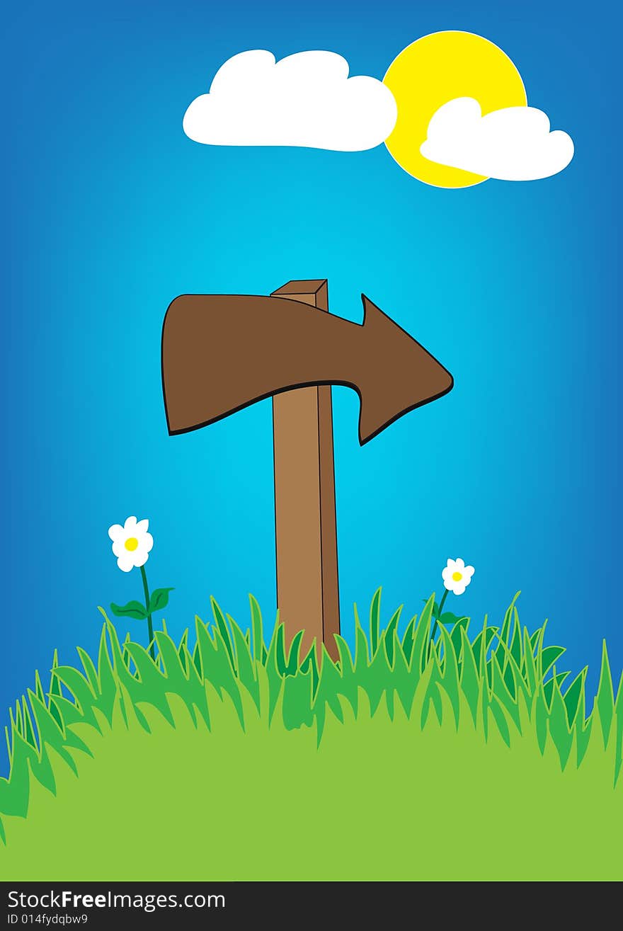 Wooden arrow, blue sky and green grass