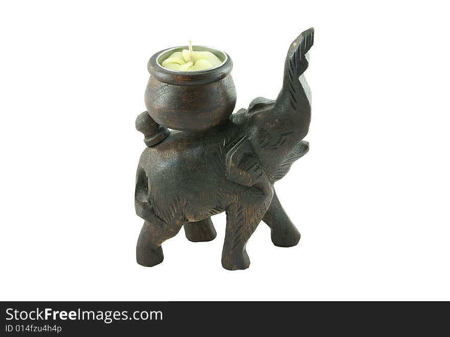 Wooden elephant with a candle on a white background