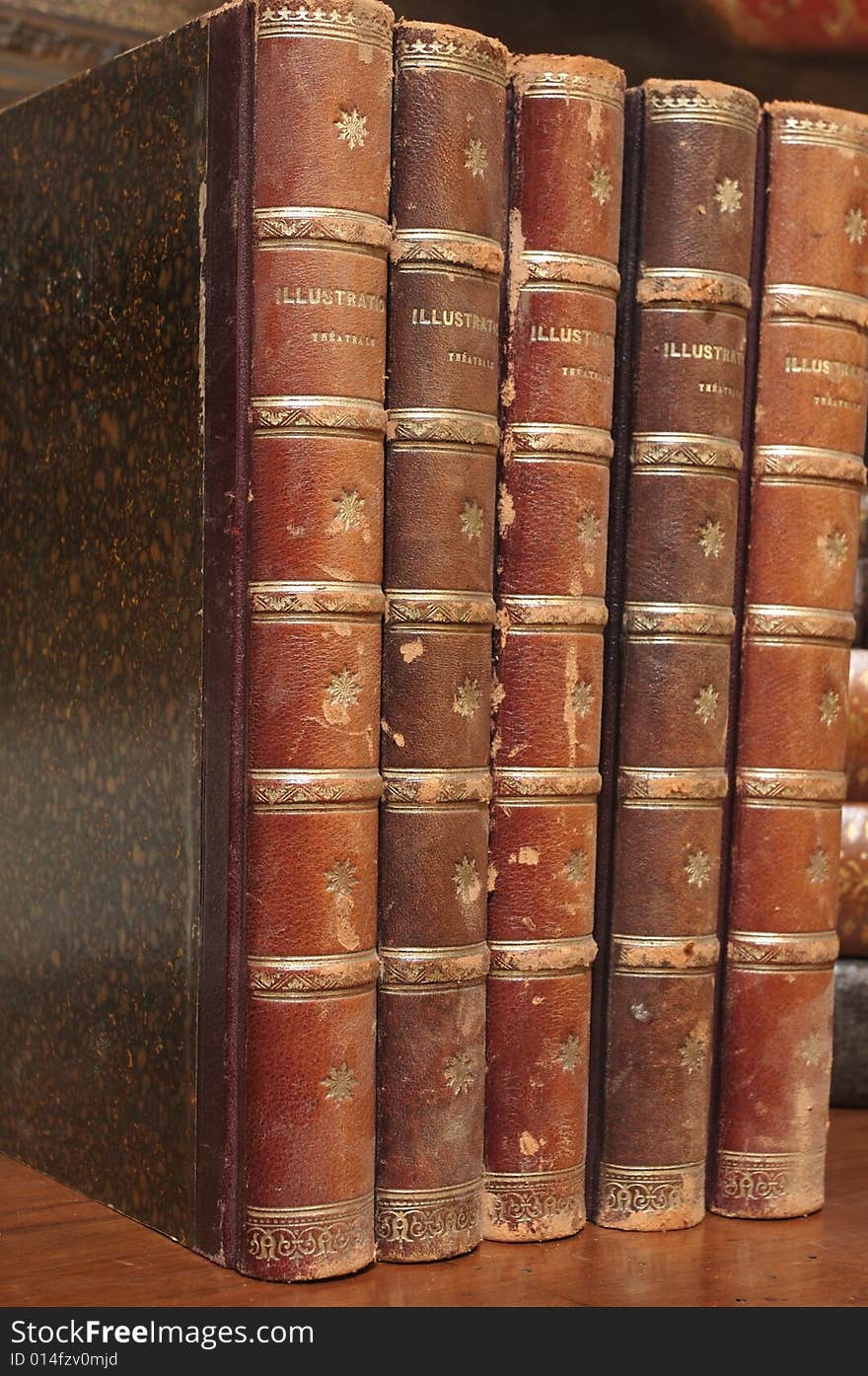 Stacks of various antique books