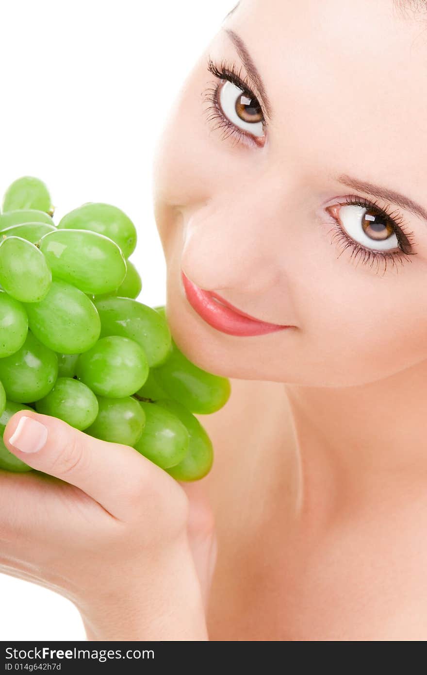 Pretty woman with green grape isolated on the white background