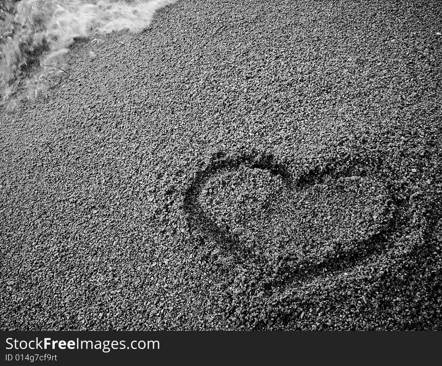 Heart draw on the sand. Heart draw on the sand