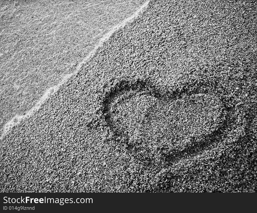 Heart draw on the sand. Heart draw on the sand