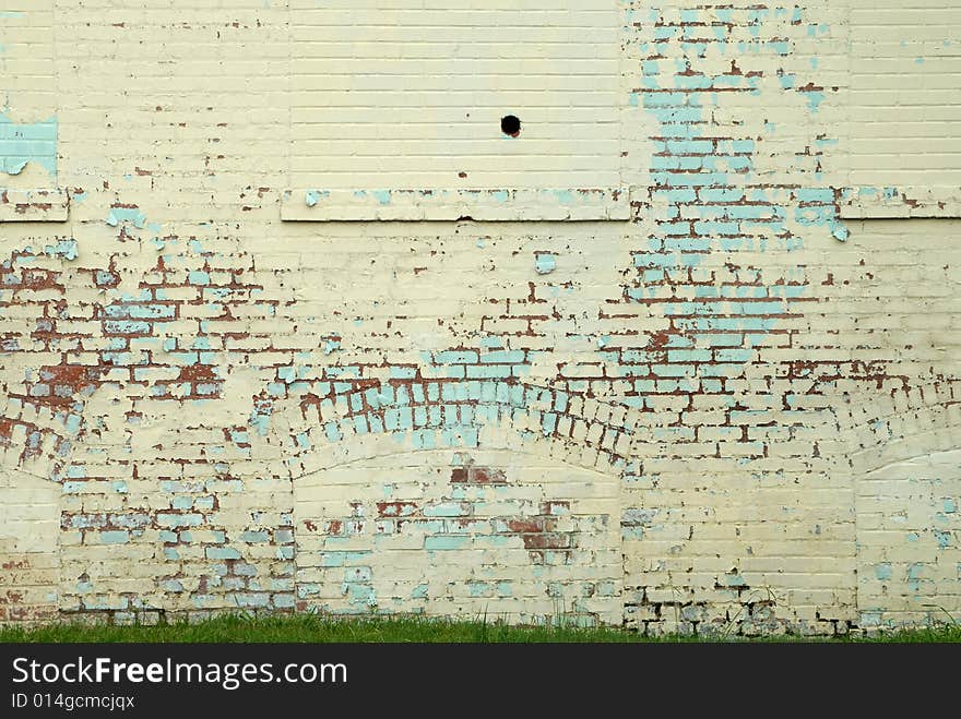 Close up of painted brick wall in weathered condition. Close up of painted brick wall in weathered condition.