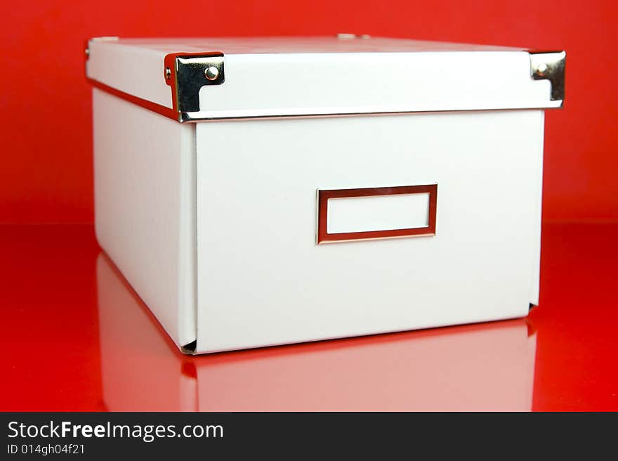 Storage boxes isolated against a red background