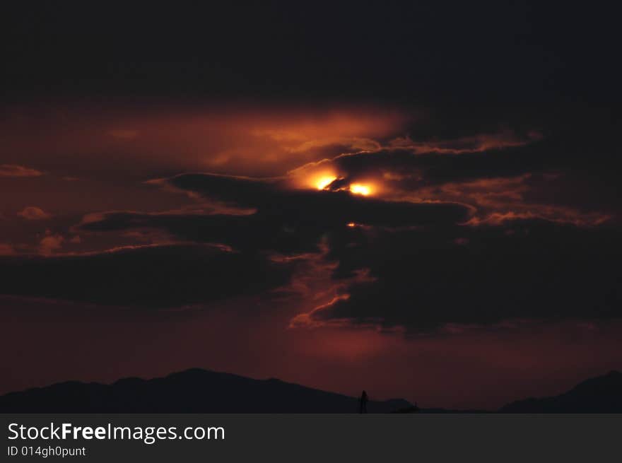 Sunset's ray from passes in the clouds, probably is the Azrael's eye. Sunset's ray from passes in the clouds, probably is the Azrael's eye