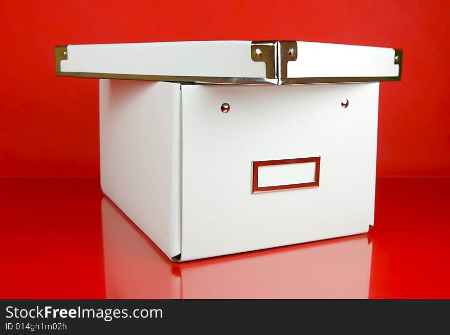 Storage boxes isolated against a red background