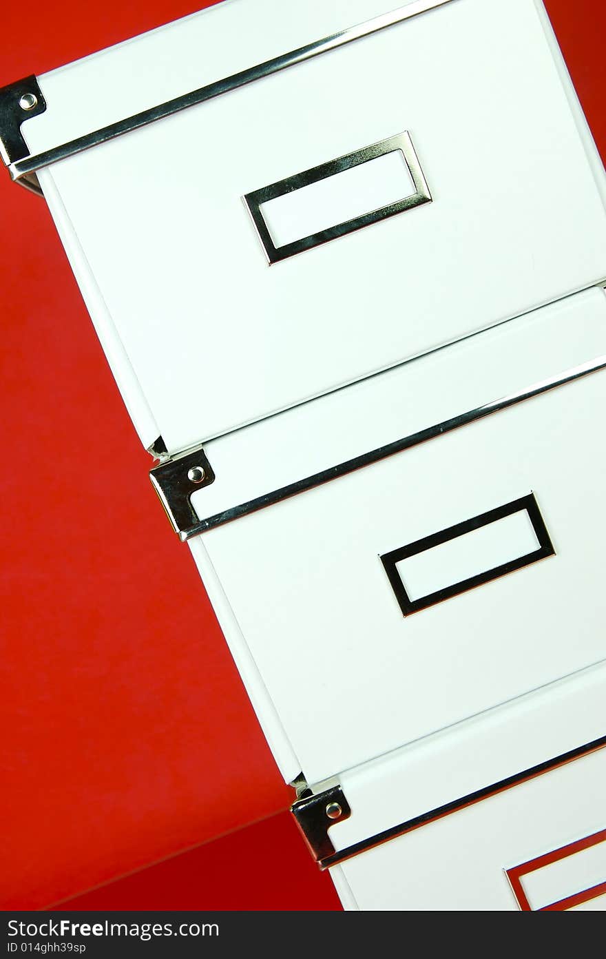 Storage boxes isolated against a red background