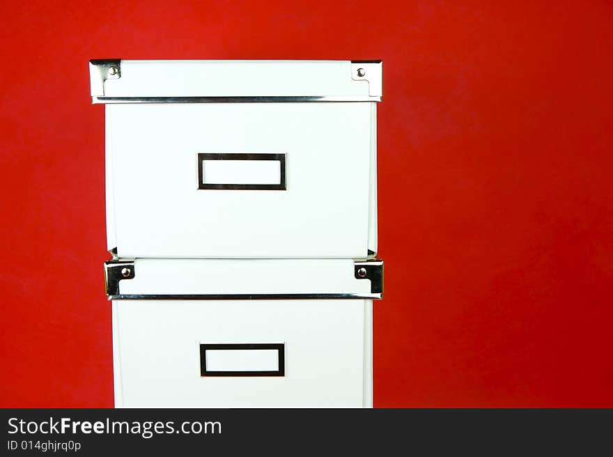 Storage boxes isolated against a red background